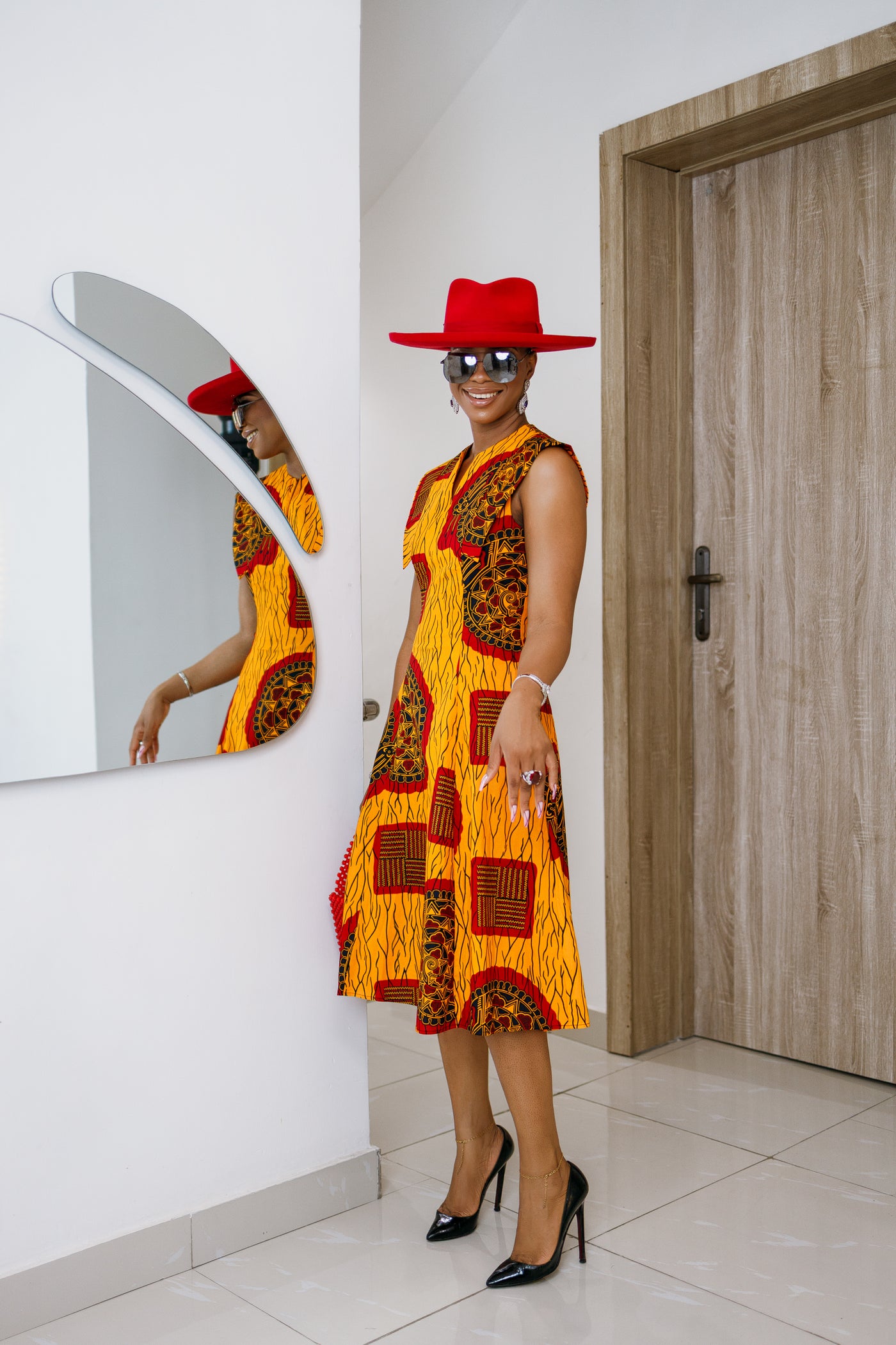 RAISA AFRICAN PRINT SLEEVELESS MIDI DRESS [ORANGE]