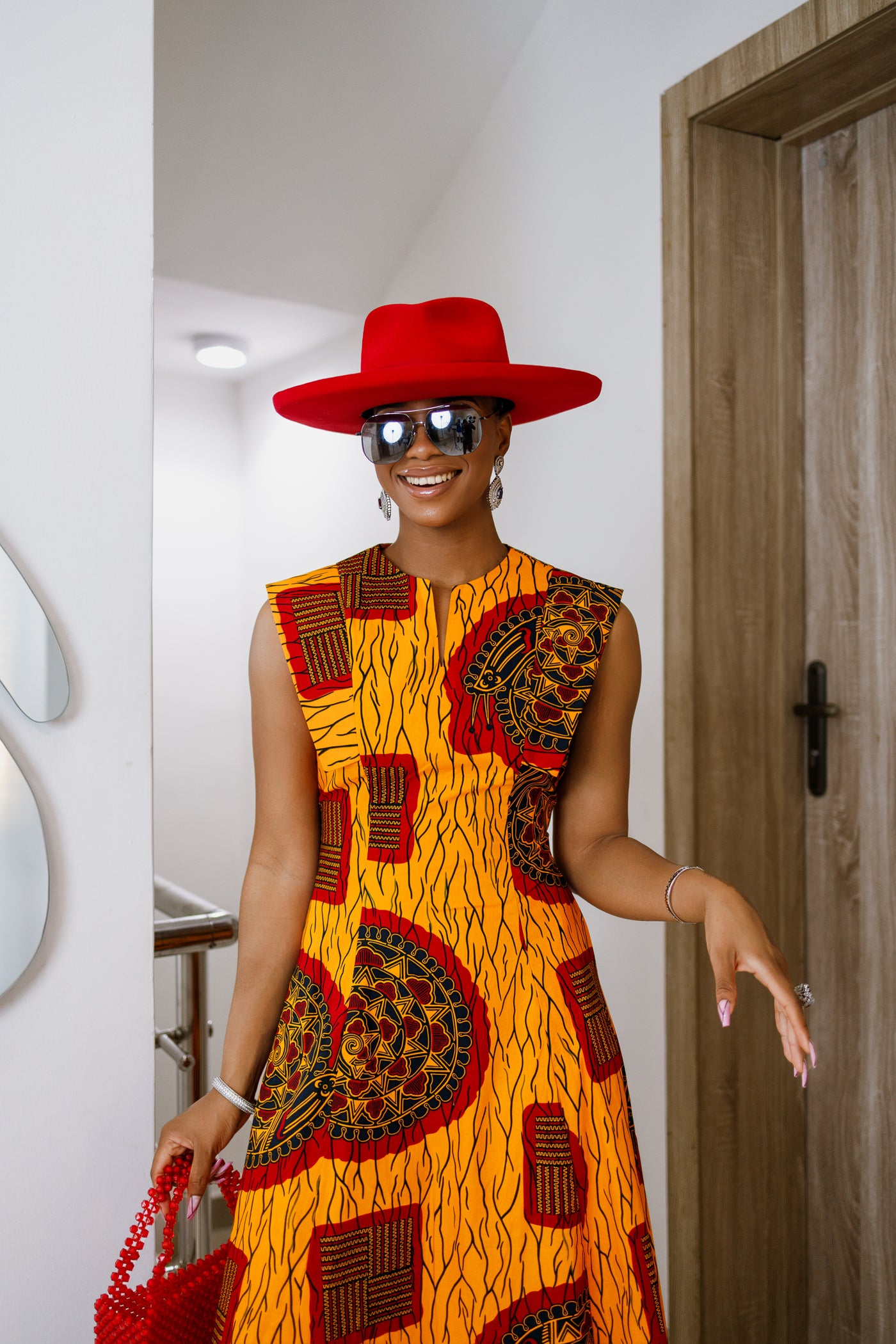 RAISA AFRICAN PRINT SLEEVELESS MIDI DRESS [ORANGE]